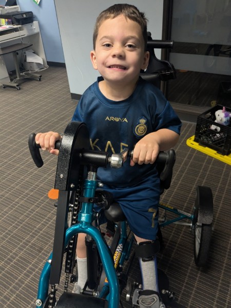 Dominic on his adaptive bike